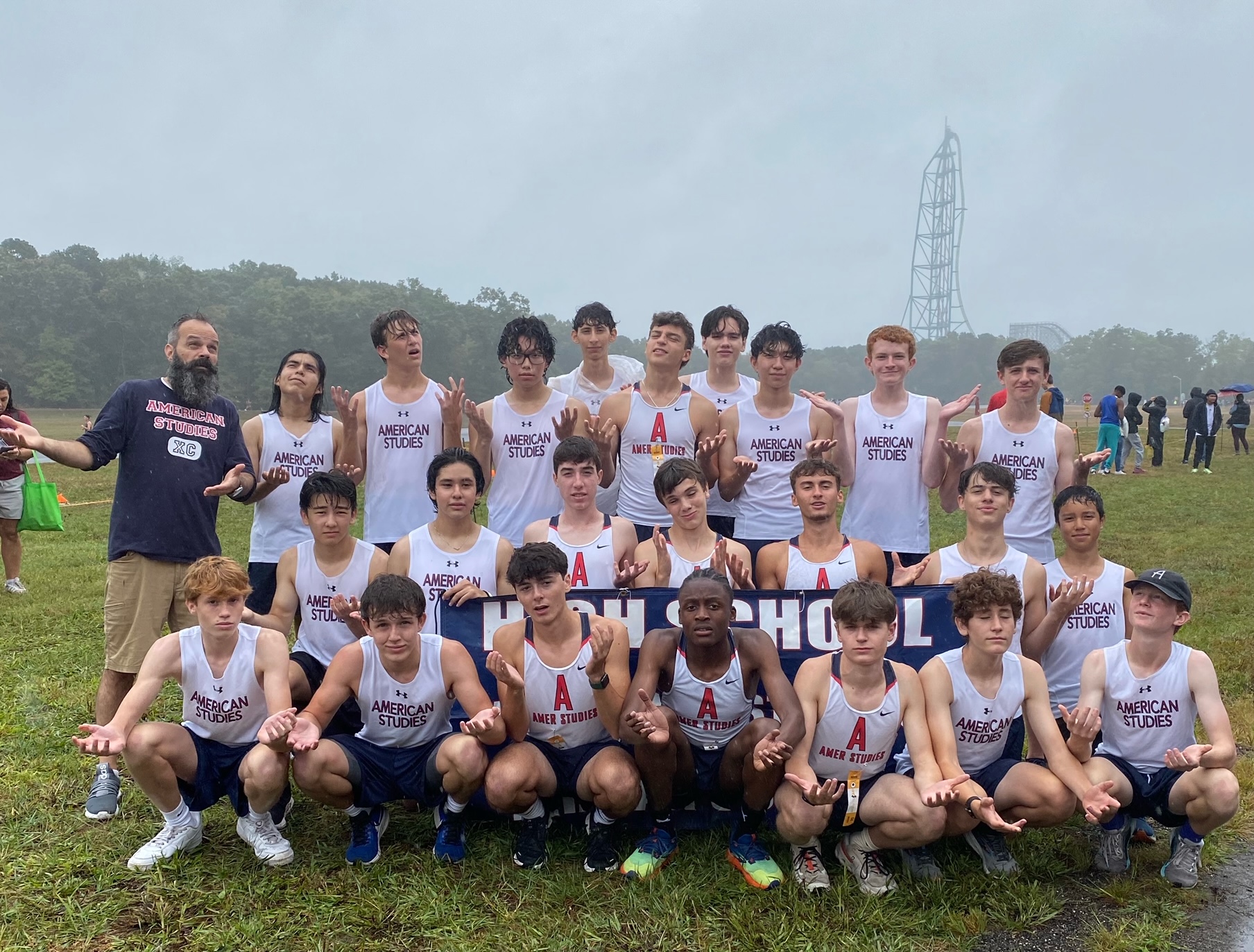 26 members of the Boys XC Team pose with their coach