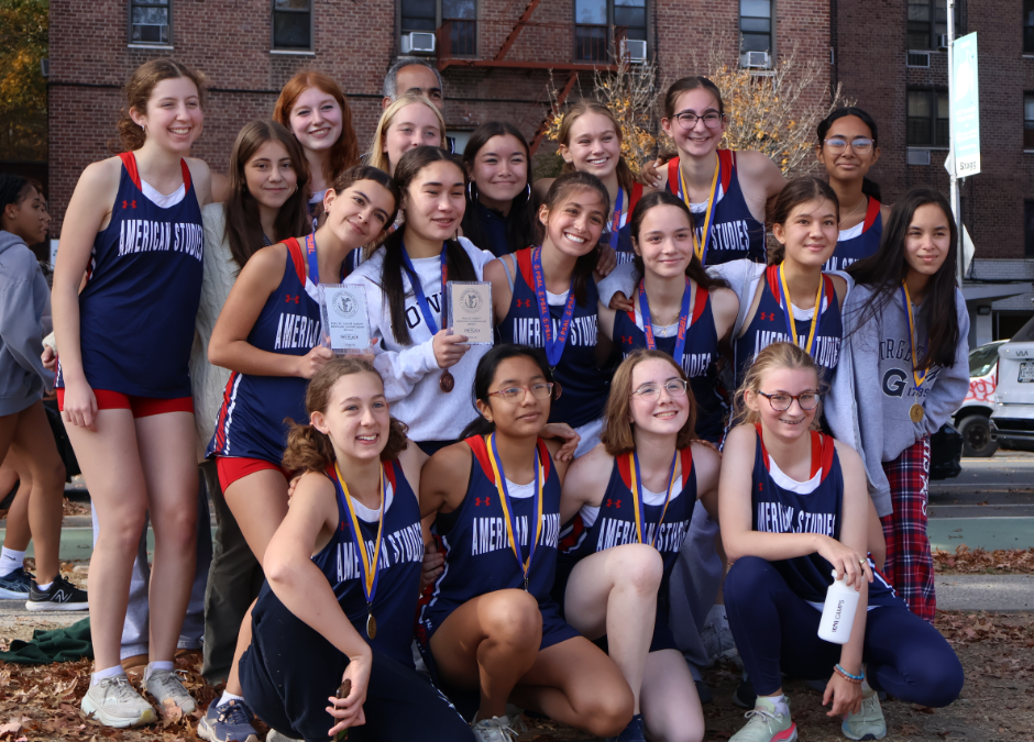 Members of the XC team stand and kneel in three rows.