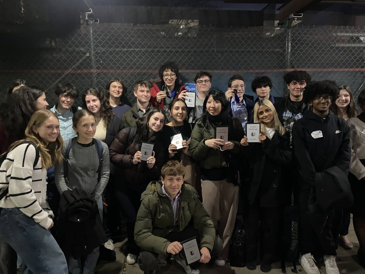 A group of students pose holding their plaques.