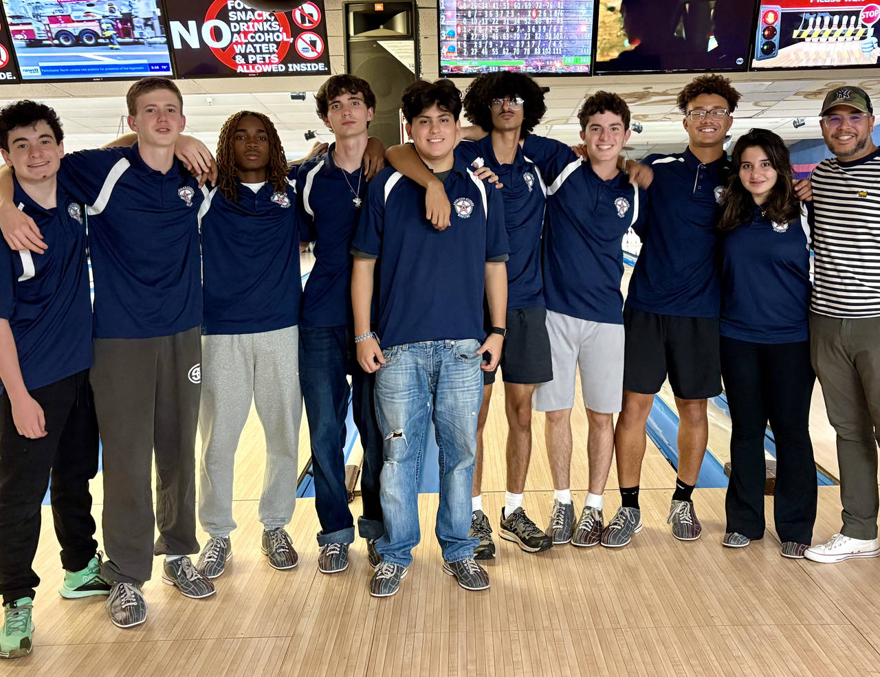 Bowling Team members stand side by side.
