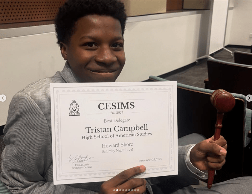 Student poses with certificate