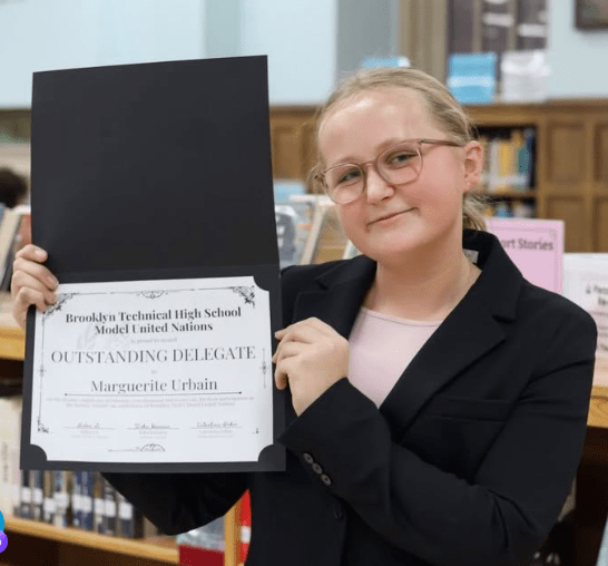 Student poses with certificate