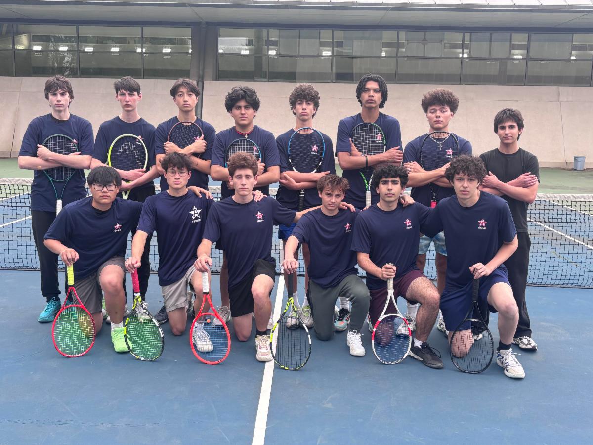 Members of the tennis team stand side by side in a row and other members kneel in a row, all facing the camera.